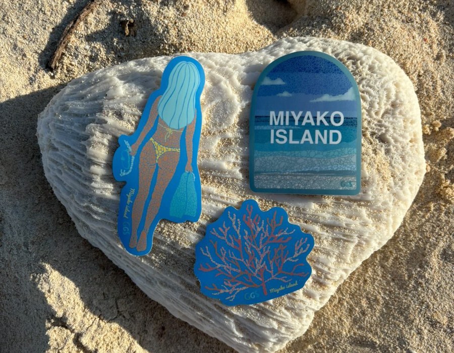 GGS tile magnets and coasters on the sand
