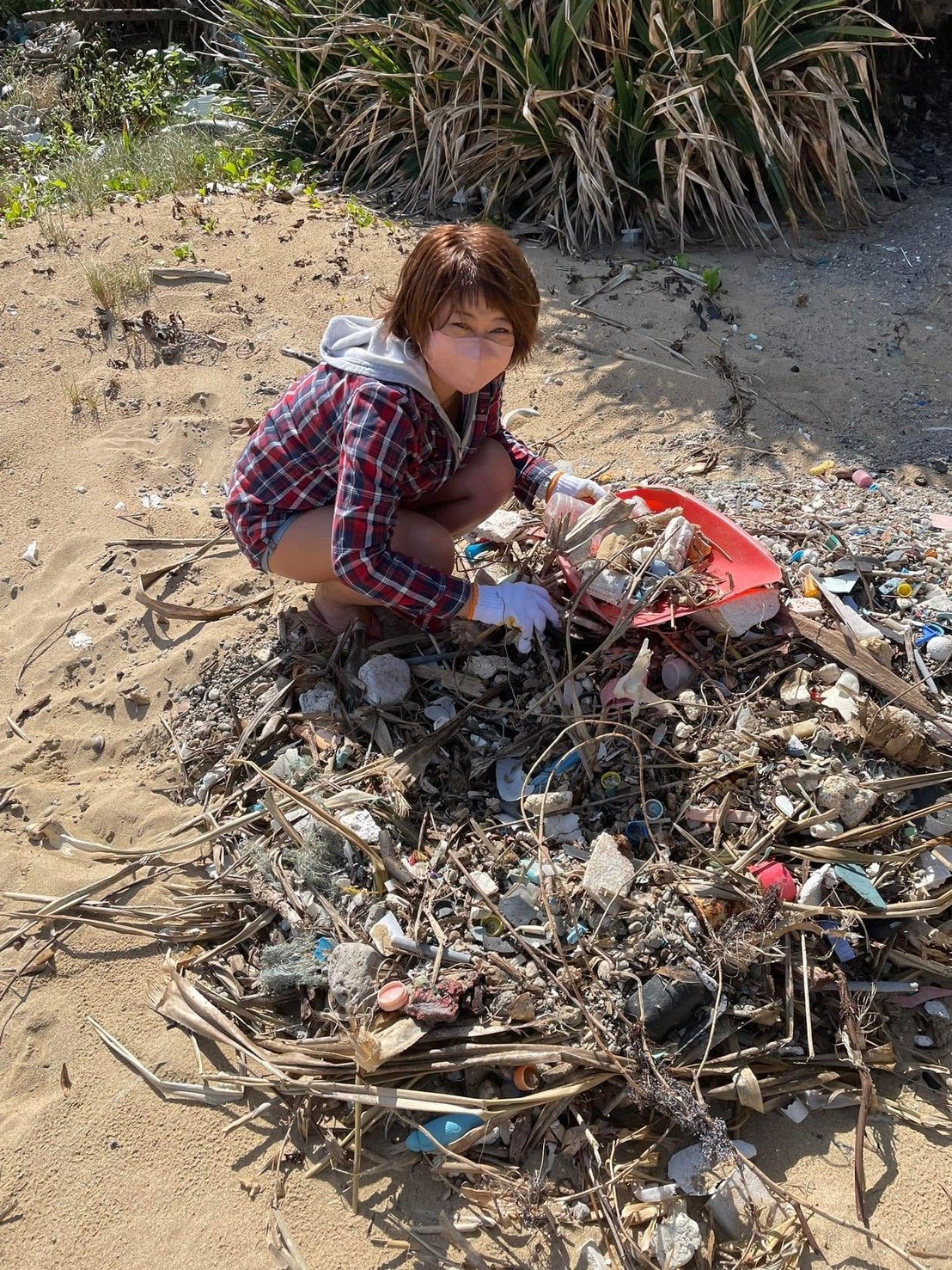 Tomoko-san joining a beach cleanup in Miyakojima