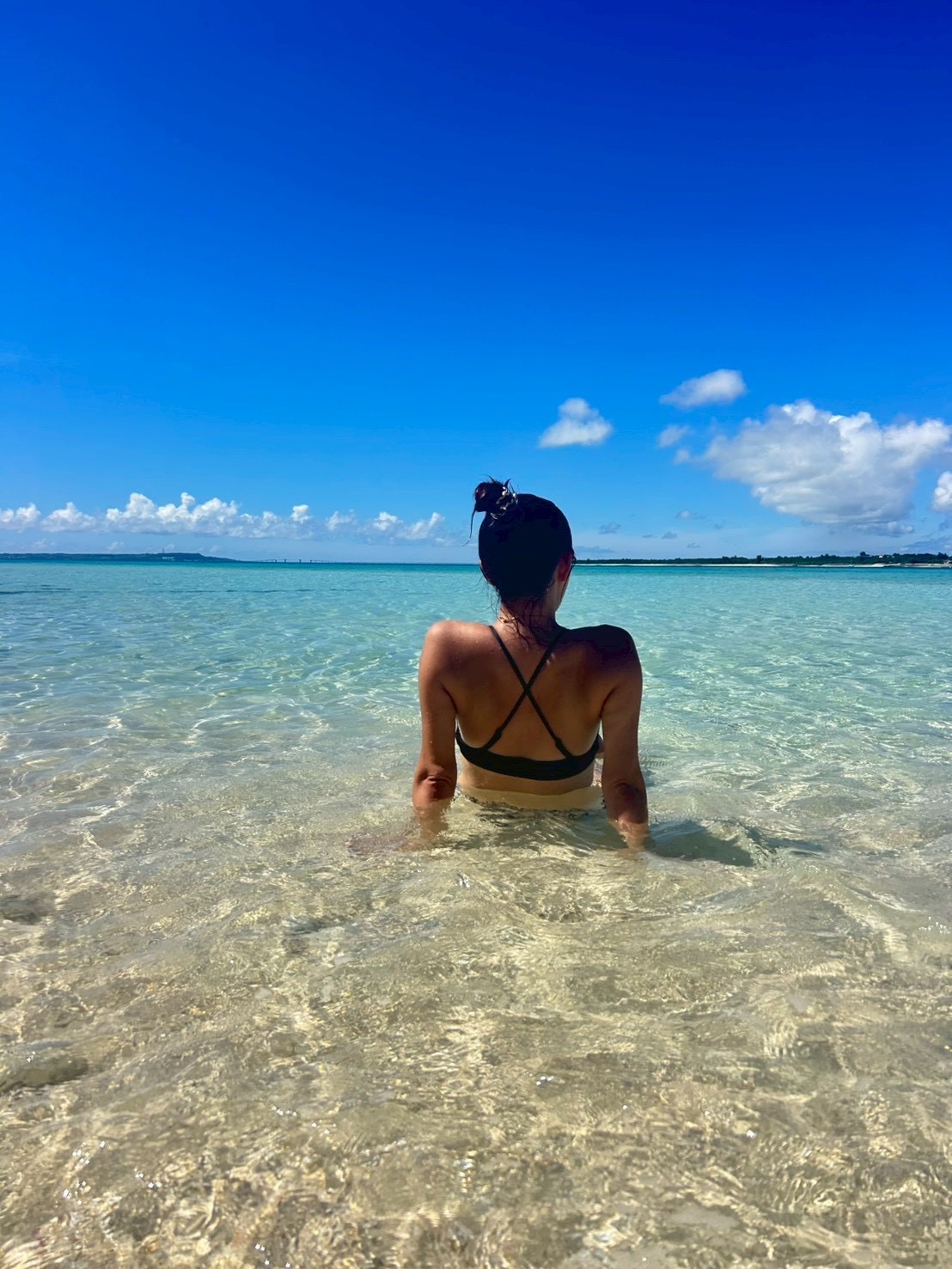 Ran looking across the clear Miyakojima sea